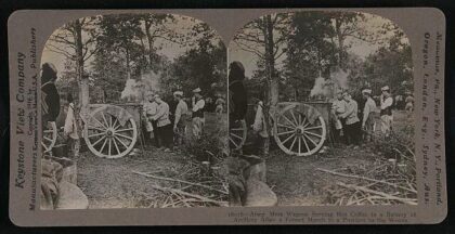 Army mess wagons serving hot coffee to a battery of artillery after a forced march to a position in the woods