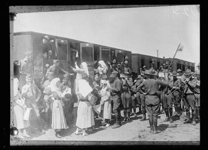 American Red Cross Canteen workers go down to the station at Issoudun to serve coffee and sandwiches to a t…