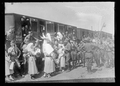 American Red Cross Canteen workers go down to the station at Issoudun to serve coffee and sandwiches to a t…