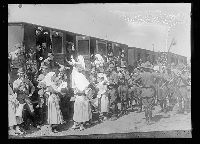 American Red Cross Canteen workers go down to the station at Issoudun to serve coffee and sandwiches to a t…