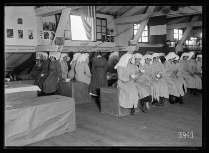Workers enjoying a cup of coffee in the AMERICAN RED CROSS warehouse Quai de Javal Paris