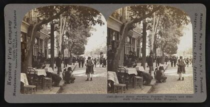Street scene showing peasant woman and sidewalk coffee-house, Sofia, Bulgaria